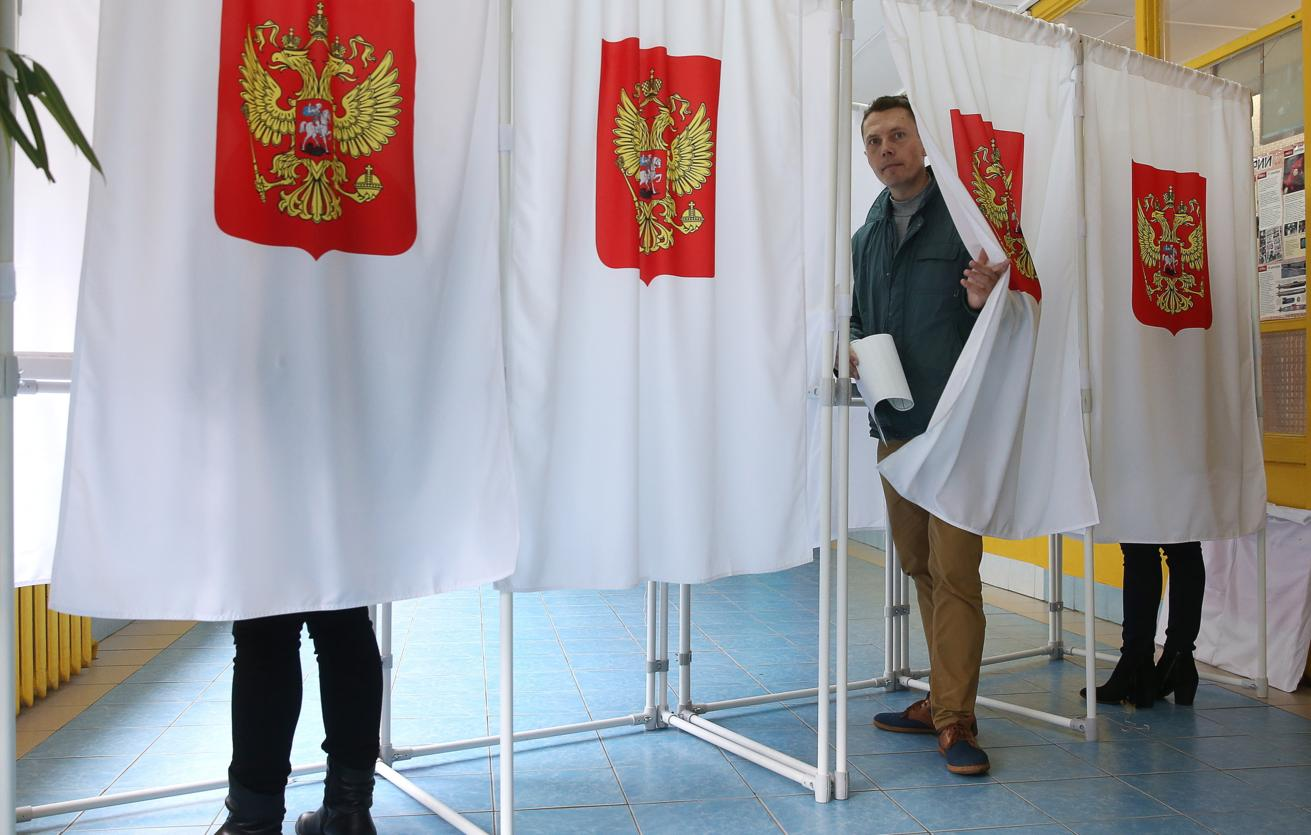 Voting booths with fabric curtains.